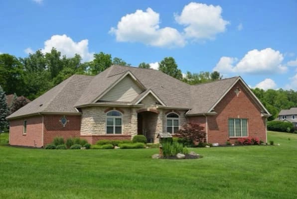 House with bright blue sky after AI sky replacement